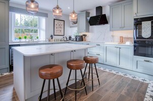 Microwave, oven, high chair, dining tables