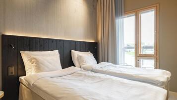 Desk, blackout drapes, bed sheets