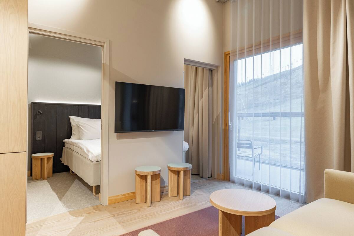 Desk, blackout curtains, bed sheets