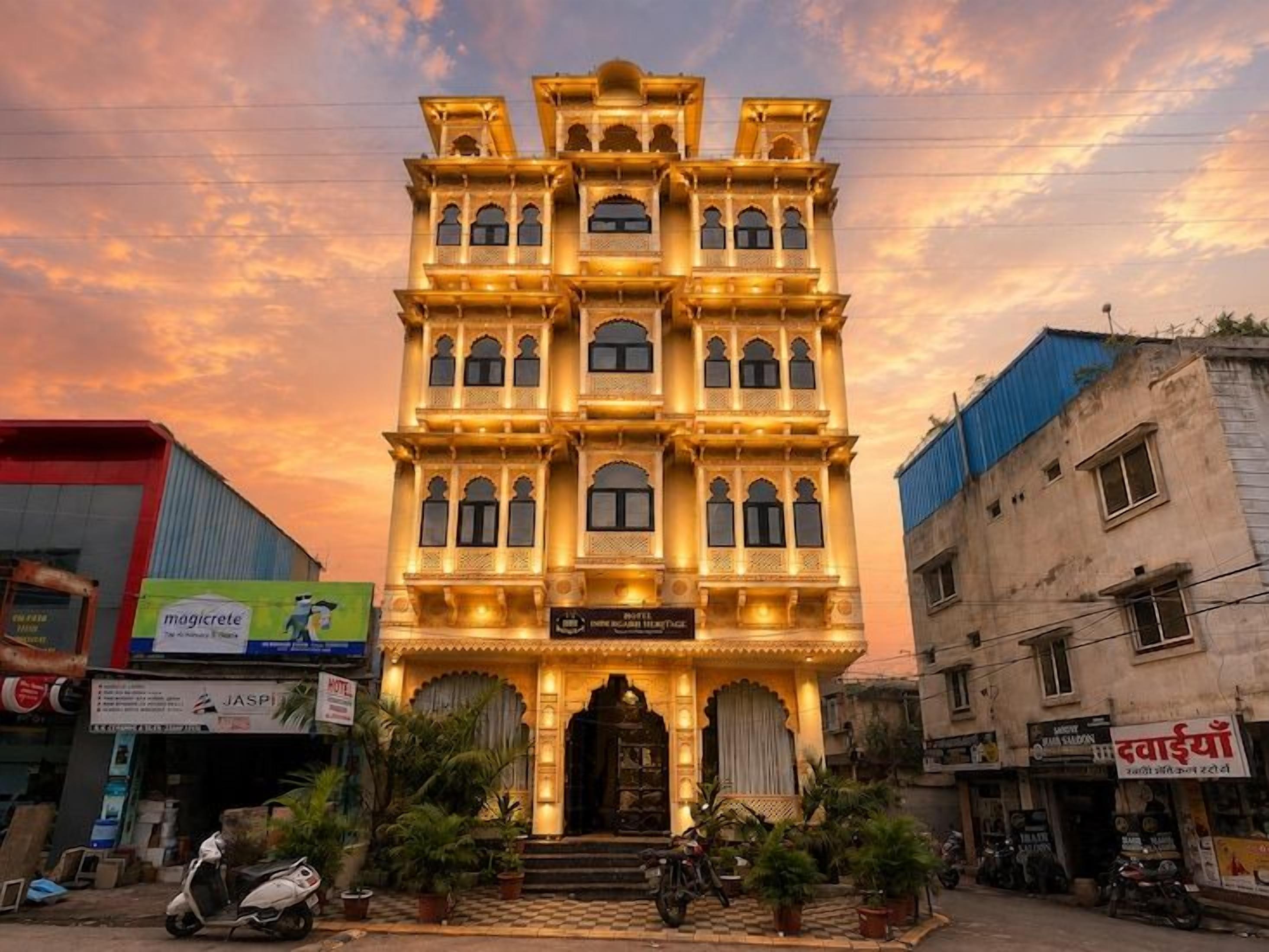 A multi-story building with a traditional architectural style, featuring multiple balconies and a central entrance.