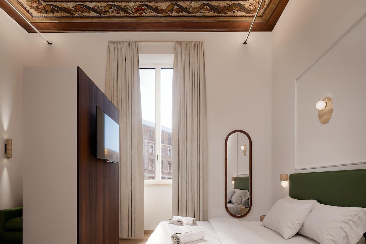 Luxury Triple Room, City View | Pillow-top beds, minibar, in-room safe, desk