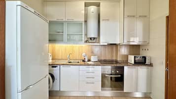 Microwave, coffee/tea maker, cookware/dishes/utensils