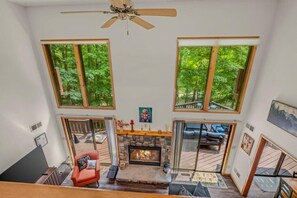 Enjoy cozy nights nestled near the gas fireplace - Skyefall Mountain Retreat: Hot Tub, Fire Pit & Wooded Views | Great for Families (Berkeley Springs)