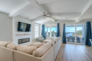 Smart TV, fireplace - Experience oceanfront luxury at Tortuga by the Sea in Oak Island, NC. (Oak Island)