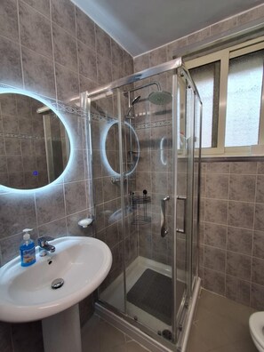 Family Apartment, Balcony, Resort View | Bathroom | Shower, towels, soap, shampoo