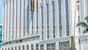 A large, modern building with a prominent vertical sign reading 'ROSWIN'. - Roswyn, A Morgans Originals Hotel (Mumbai)
