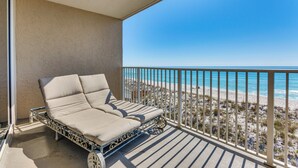 A balcony with a sun lounger overlooking a beach. - Direct Sand Access! Family Pensacola Beach Retreat (Pensacola Beach)