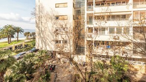 A multi-story building with a modern architectural design, featuring balconies and large windows. - Apartment Oasis with Sea View (Zadar)
