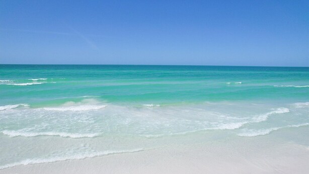 A beach with clear turquoise water and white sand. - Venice Beach Two Bedroom Private Condo with Community Pool, Gulf Beach Access and Water Views! 2 Condo (Venice)