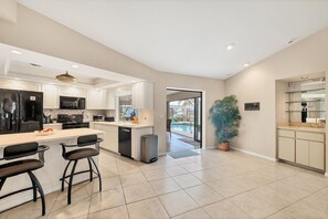 House, 3 Bedrooms | Private kitchen | Fridge, oven, coffee/tea maker, toaster - Punta Gorda Isles 3-Bedroom Canal-front Pool Home with Dock 3 Home (Punta Gorda)