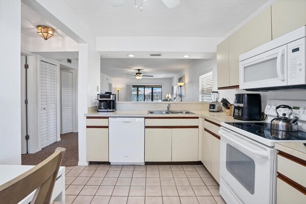 Condo, 2 Bedrooms | Private kitchen | Fridge, oven, coffee/tea maker, toaster - Punta Gorda 2-Bedroom Canalfront Condo with Dock and Pool 2 Condo (Punta Gorda)