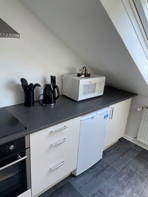 Apartamento, vista para o jardim | Cozinha privada