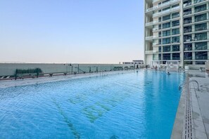 Pool - Minimalist Studio in Binghatti Azure (Jumeirah Village Circle (JVC))