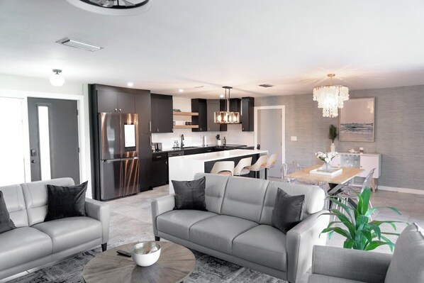 Smart TV, fireplace - Experience modern waterfront living in Cape Coral’s Yacht Club district. Walk to the beach for stunning sunsets, plug in with on-site EV charging, and keep your boat moored at our private backyard dock. Direct gulf access with no bridges! (Cape Coral)