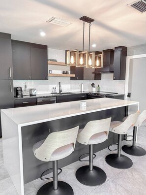 Fridge, microwave, oven, stovetop - Experience modern waterfront living in Cape Coral’s Yacht Club district. Walk to the beach for stunning sunsets, plug in with on-site EV charging, and keep your boat moored at our private backyard dock. Direct gulf access with no bridges! (Cape Coral)
