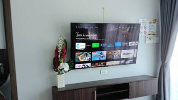 Family Villa | Living area | 50-inch LED TV with cable channels