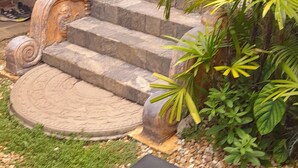 A stone staircase leading up to a building with a balcony. - The Fat Mermaid (Mirissa)