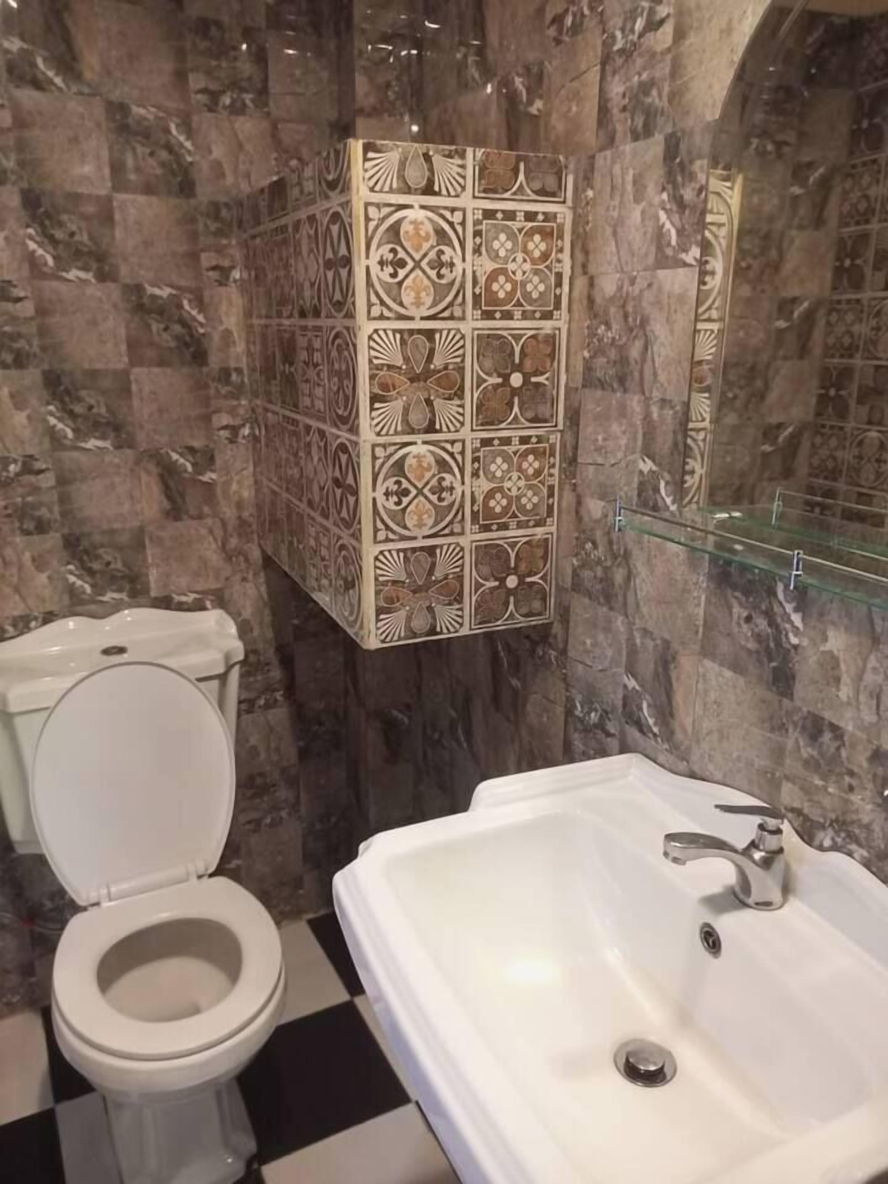 Deluxe Double Room, Courtyard View | Bathroom | Shower, towels, soap, shampoo