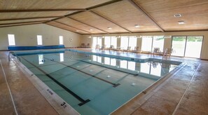 An indoor swimming pool with clear lane markings, a 'NO DIVING' sign, and a '3 ft' depth marker. - Lakefront w Dock, Pool, & Courts (Oakland)