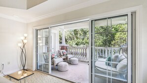 A spacious room with a large sliding glass door leading to an outdoor patio area. - JUST LISTED! Heaven On Earth! Dis/Reunion. Gorgeous, Spacious, 8 Pools, Slps 10 (Kissimmee)