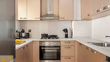 Luxury Apartment, Balcony, City View | Private kitchen | Full-sized fridge, microwave, oven, stovetop