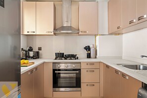 Luxury Apartment, Balcony, City View | Private kitchen | Full-sized fridge, microwave, oven, stovetop