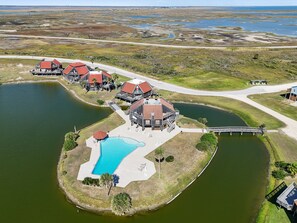 Exterior - Coastal Lagoon Retreat in Matagorda w/ Beach Views & Pool Access (Matagorda)