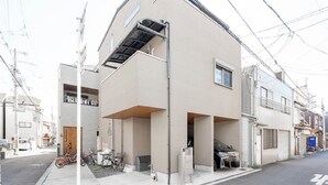 A modern two-story residential building with a flat roof and a small balcony. - Seiran Villa (Osaka)