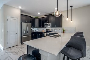 House (Multiple Bedrooms) | Private kitchen | Microwave, oven, high chair, blender - Champions Gate 8BR Villa-pool, Game Room, Theater (Davenport)