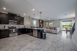 House (Multiple Bedrooms) | Private kitchen | Microwave, oven, high chair, blender - Champions Gate 8BR Villa-pool, Game Room, Theater (Davenport)