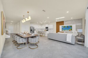 House (Multiple Bedrooms) | Living area | TV - Chic 10br Retreat With Themed Rooms & Pool (Clermont)
