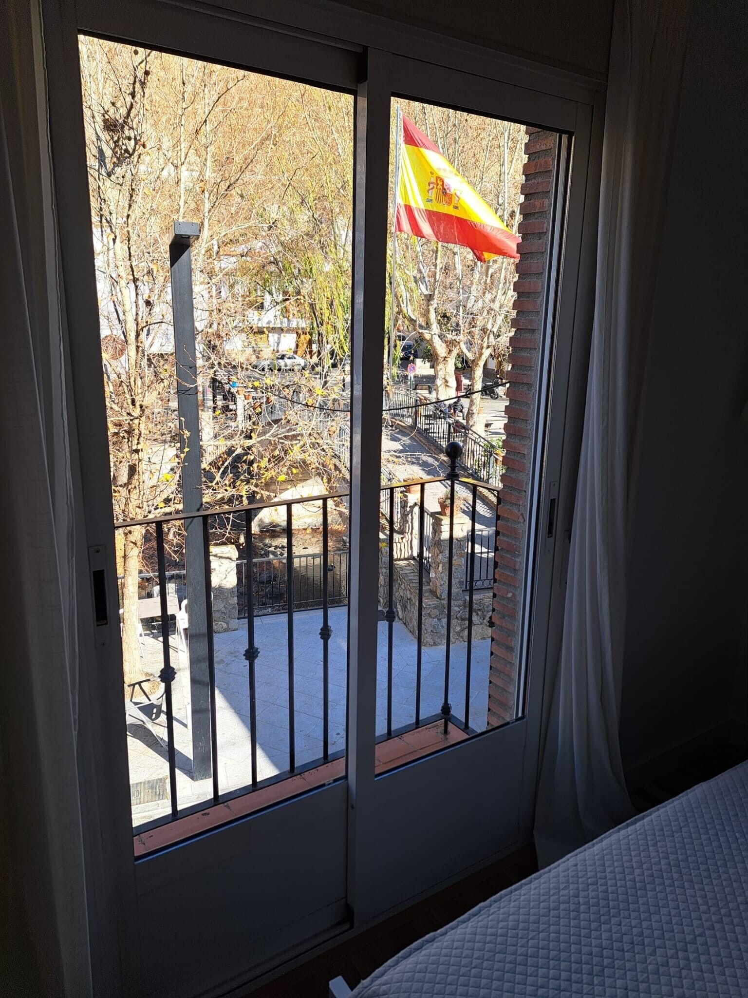 A room with a sliding glass door leading to an outdoor patio area.