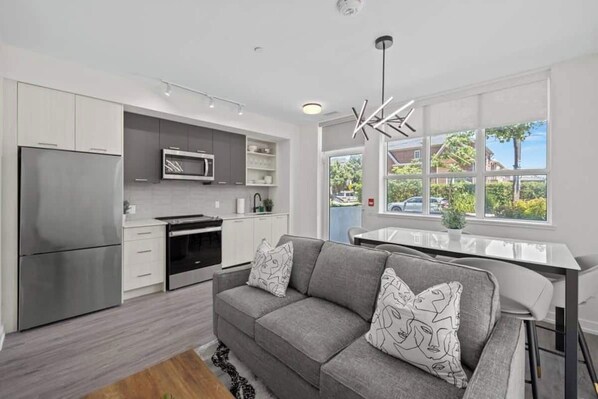 Business Apartment, 3 Bedrooms, City View | Living area | 50-inch LED TV with digital channels - Modern Stays in the Heart of the Stockyards (Toronto)