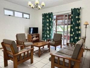 Standard Apartment, Balcony, Garden View | Living area - villaspingouin (Blue Bay)
