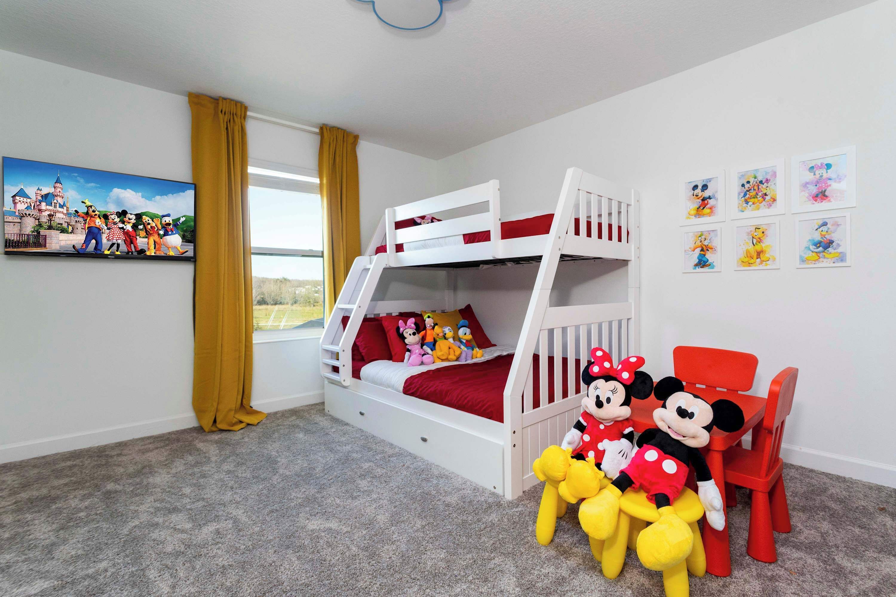 A child's room with a bunk bed, Mickey and Minnie Mouse plush toys, and Disney-themed artwork.