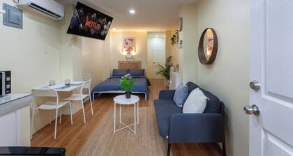 Cozy 1-bedroom studio in tranquil Quezon City with AC