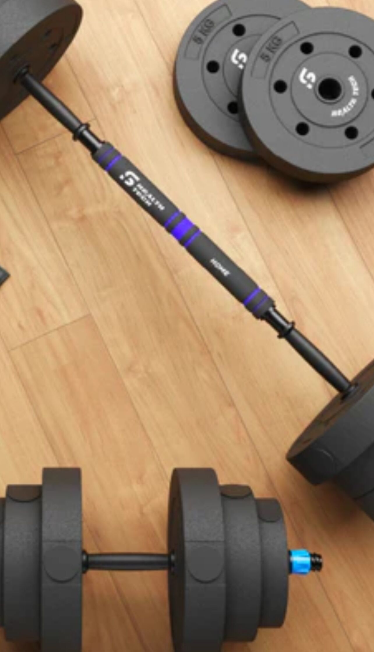 A barbell with weight plates on a wooden floor.