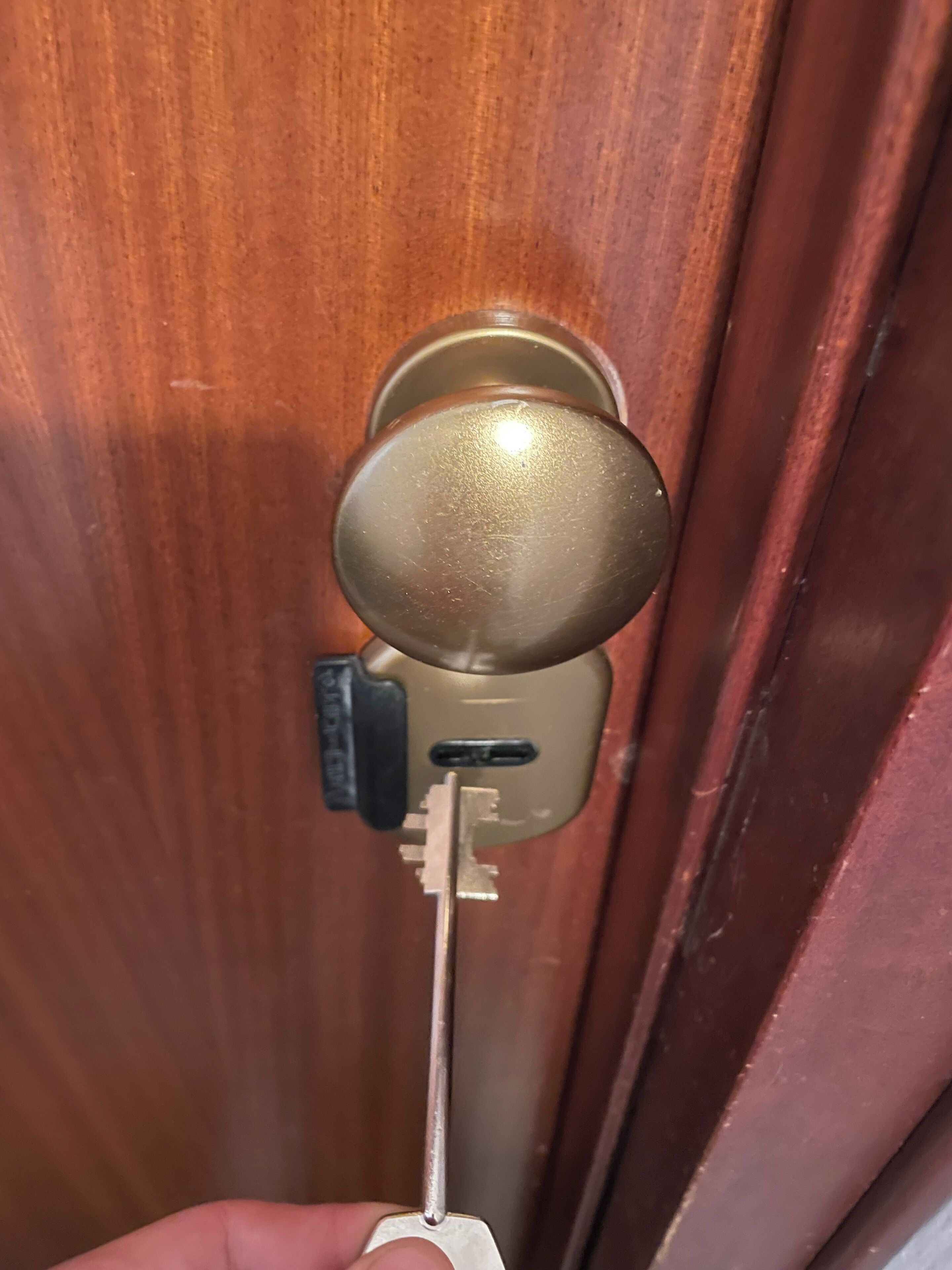 A key inserted into a door lock.