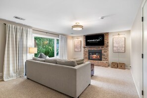 Villa (5 Bedrooms) | Living area | TV, fireplace, books