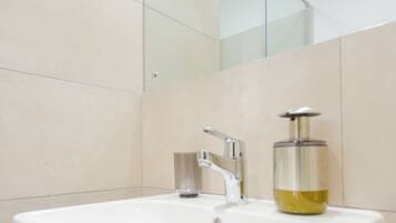 Shower, eco-friendly toiletries, towels, soap