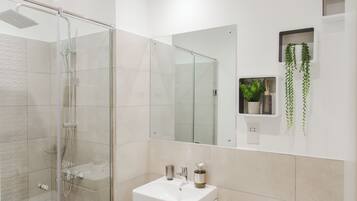 Shower, eco-friendly toiletries, towels, soap