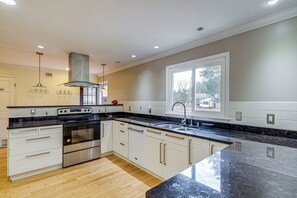 Fridge, stovetop, dishwasher, coffee/tea maker