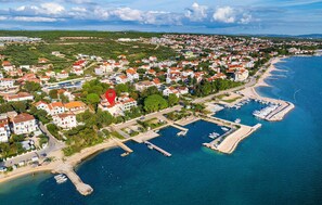 An aerial view of a coastal town with residential buildings, a marina, and a beach. - 1 bedroom amazing apartment in Turanj (Turanj)