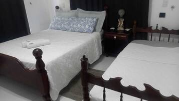 Deluxe Suite, Garden View | Blackout drapes, iron/ironing board, free WiFi