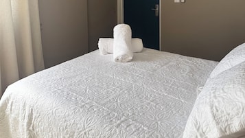 Desk, laptop workspace, blackout curtains, iron/ironing board