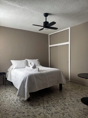 Desk, laptop workspace, blackout curtains, iron/ironing board