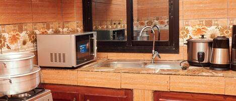 Comfort Apartment, Balcony | Private kitchen | Full-sized fridge, microwave, oven, cookware/dishes/utensils