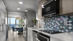Una cocina moderna con una isla grande, electrodomésticos de acero inoxidable y vistas al exterior.
