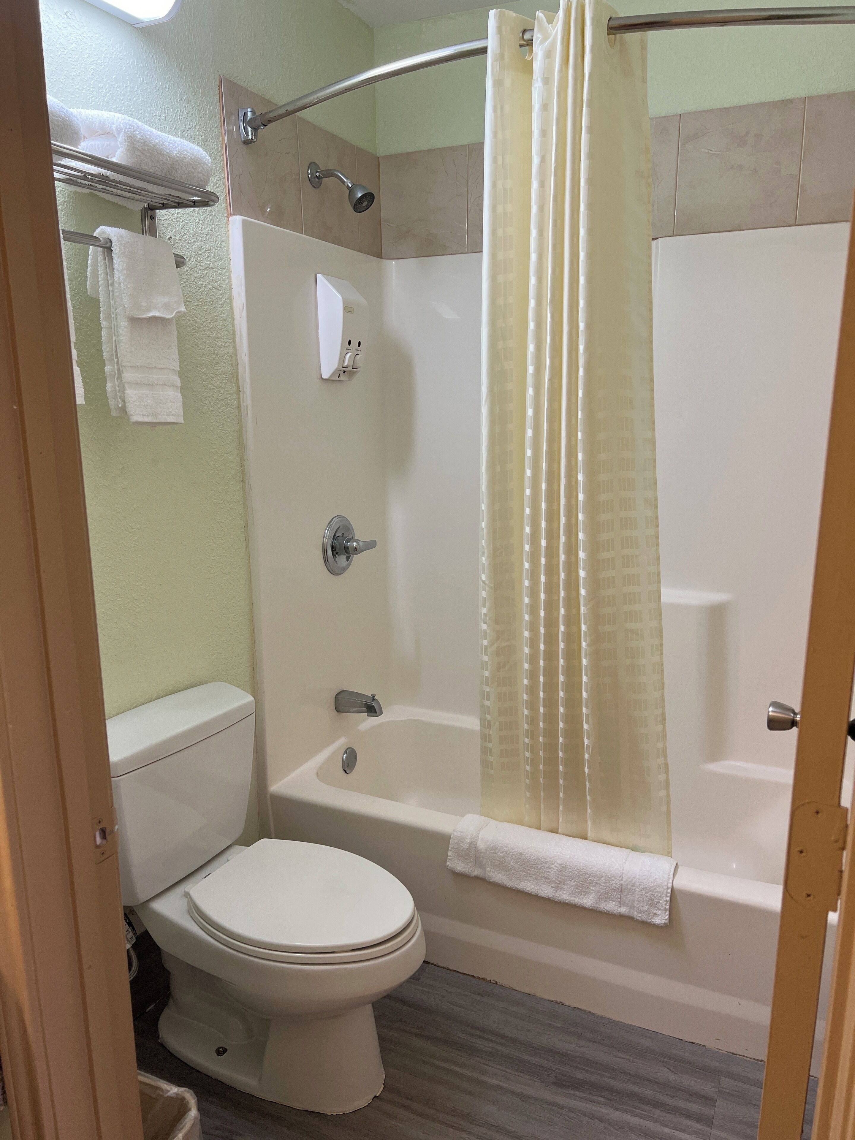 Combined shower/tub, hair dryer, towels, soap