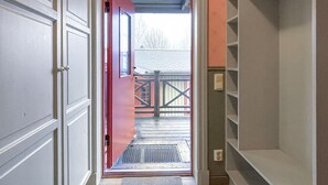 A narrow hallway leading to a wooden deck with a metal grate at the entrance. - 2 bedroom beautiful apartment in åre (Åre)